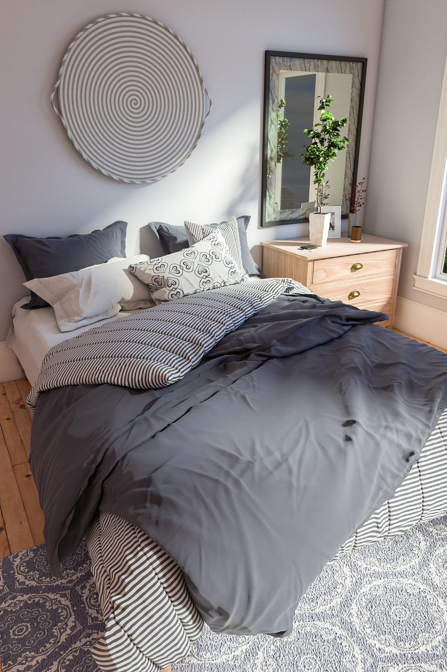 Bedroom with a charcoal duvet and a round mirror